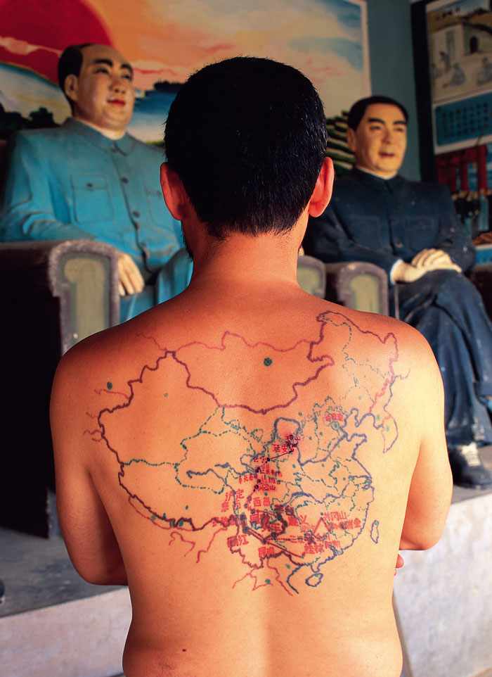 tattooed map on his back